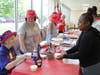 Ladies from the Red Hat Society dished up nearly 300 chocolate sundaes to St. Coletta's students, staff and adult participants on July 25.