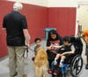 Kare 9 Nigel greets a Kennedy School student during a special visit on Aug. 9. Nigel has a way of helping reduce anxiety, boost communication skills and support the emotional and social needs of children with developmental disabilities.
