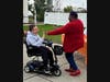 Arlene Perry, a Qualified Intellectual Disabilities Professional at St. Coletta’s of Illinois, gives a participant a high five after he sinks a bean bag in a game of toss.