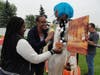 St. Coletta’s Toshannia Jones and Carolyn Simms put the finishing touches on Glamour Girl, a scarecrow entered in St. Coletta’s Fall Fest Scarecrow Contest.