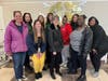 A group of St. Coletta’s of Illinois employees gather for a photo before heading to Feed My Starving Children in Aurora to package meals for hungry children. 