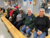 A group of St. Coletta’s of Illinois employees prepare to package meals for hungry children at Feed My Starving Children in Aurora on Nov. 15.