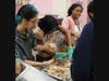 Culinary arts students separate the turkey meat from the bone as they prepare to serve Thanksgiving dinner to nearly 100 classmates, teachers and staff at St. Coletta’s Kennedy School on Nov. 22.