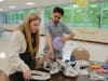 Andrew High School junior Abby Zurek and senior Brian Ondras string together a series of silver letters and numbers to read “prom 2024.”