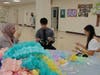 Andrew High School students prepare streamers for Kennedy School’s prom.