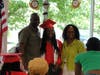Graduate Jordan S. beams with pride while posing for a family photo on graduation day at the Lt. Joseph P. Kennedy Jr. School for Exceptional Children on May 22, 2024.