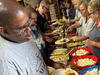 Members of All Saints Lutheran Church serve up hamburgers, hot dogs and homemade side salads to participants of St. Coletta’s of Illinois’ Community Day Services program on June 5.