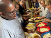 Members of All Saints Lutheran Church serve up hamburgers, hot dogs and homemade side salads to participants of St. Coletta’s of Illinois’ Community Day Services program on June 5.