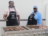 Shuntai Robinson and Erika Rodgers from St. Coletta’s Social Services Department grill up delicious burgers for the celebration, adding to the fun and flavor of this year’s Fall Fest.