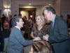 Sr. Joanne Schatzlein, director of corporate ministries, greets Board member Susan Poole and her husband, Tom, at St. Coletta’s Caritas Benefit on Nov. 9.  

