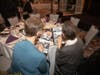 Sr. Joanne Schatzlein and Sr. Wanda Sheber look for familiar faces in photographs taken during Coletta’s of Illinois’ 75 years of service. The social service agency was founded in 1949 by the Sisters of St. Francis of Assisi.