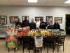 Kennedy School students gather around a table filled with Thanksgiving ingredients generously donated by St. Bernard's Parish, ready to create a feast full of gratitude and delicious flavors! 