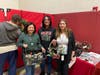 St. Coletta’s Chief Financial Officer Geraldine Fernando, AR/AP Manager Laura Vander Meulen and HR Director Gladys Ramirez enjoy shopping and supporting local talent at the Kennedy School Dessert & Craft Fair.