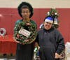 Kennedy School students get ready to welcome guests to their annual Holiday Dessert & Craft Fair.