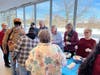 Volunteers from All Saints Lutheran Church scoop up generous servings of ice cream for St. Coletta’s participants, bringing smiles and laughter to the special gathering.