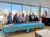 Volunteers from All Saints Lutheran Church stand ready at their ice cream station, eager to dish up delicious sundaes and spread joy to St. Coletta’s participants.

