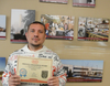 Nick T. proudly shows the certificate he received after participating in a bagging competition at the Orland Park Jewel-Osco on March 8.