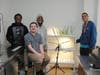 Kennedy School students proudly stand beside their thriving hydroponic system, where they’ve been growing herbs, vegetables and fruit as part of a hands-on science and sustainability project. 