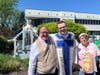 Fr. Dan Korenchan shares a joyful moment with St. Coletta’s participants David and Amy during the May Crowning ceremony, celebrating faith and community together.