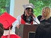 Eighth-grade graduate Leilah delivers a heartfelt speech, thanking her parents for always being there for her and supporting her, as Kennedy School teacher Jackie DeMarco stands proudly by her side. 