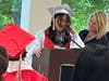 Eighth-grade graduate Leilah delivers a heartfelt speech, thanking her parents for always being there for her and supporting her, as Kennedy School teacher Jackie DeMarco stands proudly by her side. 