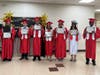 The Kennedy School Class of 2025 included six high school and one middle school graduates.