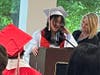 Eighth-grade graduate Leilah delivers a heartfelt speech, thanking her parents for always being there for her and supporting her, as Kennedy School teacher Jackie DeMarco stands proudly by her side. 