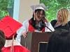Eighth-grade graduate Leilah delivers a heartfelt speech, thanking her parents for always being there for her and supporting her, as Kennedy School teacher Jackie DeMarco stands proudly by her side. 