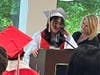Eighth-grade graduate Leilah delivers a heartfelt speech, thanking her parents for always being there for her and supporting her, as Kennedy School teacher Jackie DeMarco stands proudly by her side. 