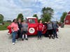 Farmers” Deareo, Debbie Macenas, Billy, Ronna, Scott and Jennifer gather for a group photo in front of a Navarro Farm truck. Together, they’re growing skills, friendships and confidence through their weekly farm visits.