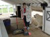Ronna, a participant in St. Coletta’s adult day program, sweeps up after the goats at Navarro Farm. The hands-on chores teach responsibility and provide a sense of accomplishment as part of the farm’s inclusive enrichment experience.