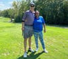 Golfer Jason Keller of Naperville celebrates his hole-in-one at last year’s Kennedy Golf Outing with Donnisha, a participant in St. Coletta’s of Illinois' Community Day Services program. 