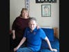 Jerry and his sister Kathy share a smile in his baseball-themed bedroom at St. Coletta’s Intermediate Care Facility—a space filled with personal touches that reflect his interests and make him feel right at home. 