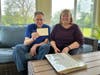 Jerry holds his original 1967 enrollment card, carefully typed by the Sisters of St. Francis of Assisi. 