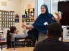 Maria Demakis shares a celebratory high-five with a student during a Black History Month lesson exploring the lives and legacies of influential Black leaders, innovators and artists.