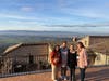 Shalini Kumar, Meredith O’Brien, Sr. Joanne Schatzlein, OSF, and Charla Brautigam pause for a photo on a rooftop overlooking Assisi during their 10-day Franciscan pilgrimage to Italy. 