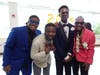 All dressed up and ready to celebrate, four Kennedy School students pose together for a group photo, capturing the fun, friendship and excitement of prom day.