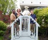 Kennedy School student Najee and Community Day Services participant Cole pose with St. Coletta’s CEO Heather Benedick after crowning the Blessed Mother statue during the organization’s annual May Crowning celebration.