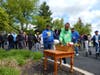 Two Kennedy School students place flowers in the basket beneath the Blessed Mother statue during St. Coletta’s annual May Crowning celebration, honoring a cherished tradition of faith, prayer and devotion.