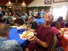 Chris shows off his picnic lunch with a smile during the first Summer Picnic of the season, hosted by All Saints Lutheran Church for participants in St. Coletta’s Community Day Services program.