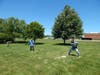 Pastor Don Borling tosses a ball to Nick during a game at the first Summer Picnic at All Saints Lutheran Church in Orland Park.