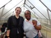 Mental Health Professional Richanne Matthews celebrates with Dee after planting a seed pod filled with squash seeds in the greenhouse. With a little care, patience and sunshine, they’ll be watching their hard work grow in the weeks ahead.
