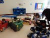 Ready to roll! Kennedy School students proudly pose with their one-of-a-kind box cars after taking part in the school's first-ever Box Car Parade.