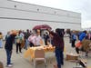 Clinical Therapist David Saavedra reacts as an adult participant knocks down a stack of cans at Fall Fest.