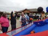 An adult participant shooting hoops at Fall Fest.