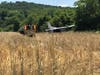 Members of the Ellington Volunteer Fire Department tend to the scene of a plane crash at Ellington Airport Saturday morning.