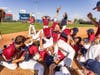 The Eastern Connecticut State University baseball team forms the traditional championship pile after winning the national title Tuesday.