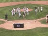 The Fairfield Warde Mustangs celebrate a state title shortly after the final out in Saturday's championship game in Middletown.