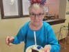 Frances St. Laurent of Farmington has her cake and eats it too at her apartment complex's 
Fourth of July celebration recently.