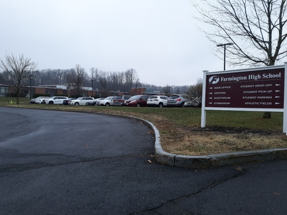 A Farmington High School teacher and cross-country coach is on paid leave pending an investigation for a 'personnel matter.'